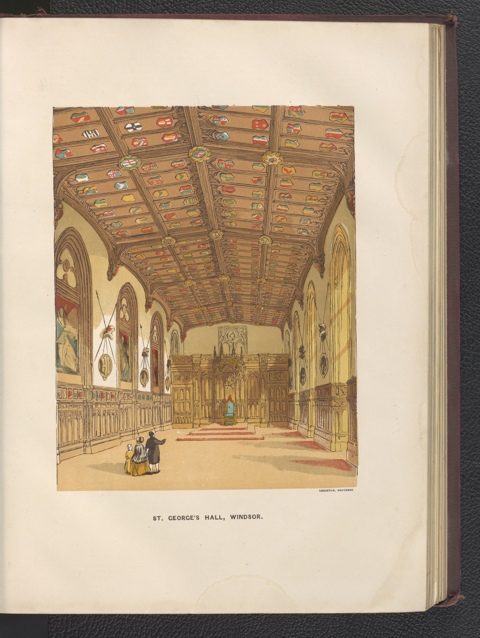 Offenes Buch mit detaillierter Illustration des Inneren von St. Georgs Halle in Windsor, England, mit sichtbarer Architektur und Figuren, auf schwarzer Oberfläche.