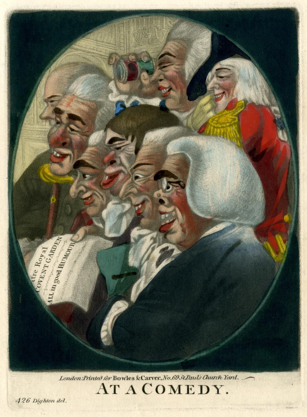 Eine Gruppe von Menschen in einem Kreis, die zusammen lachen, wobei eine Person ein Blatt Papier hält, bei einem Comedy-Event.