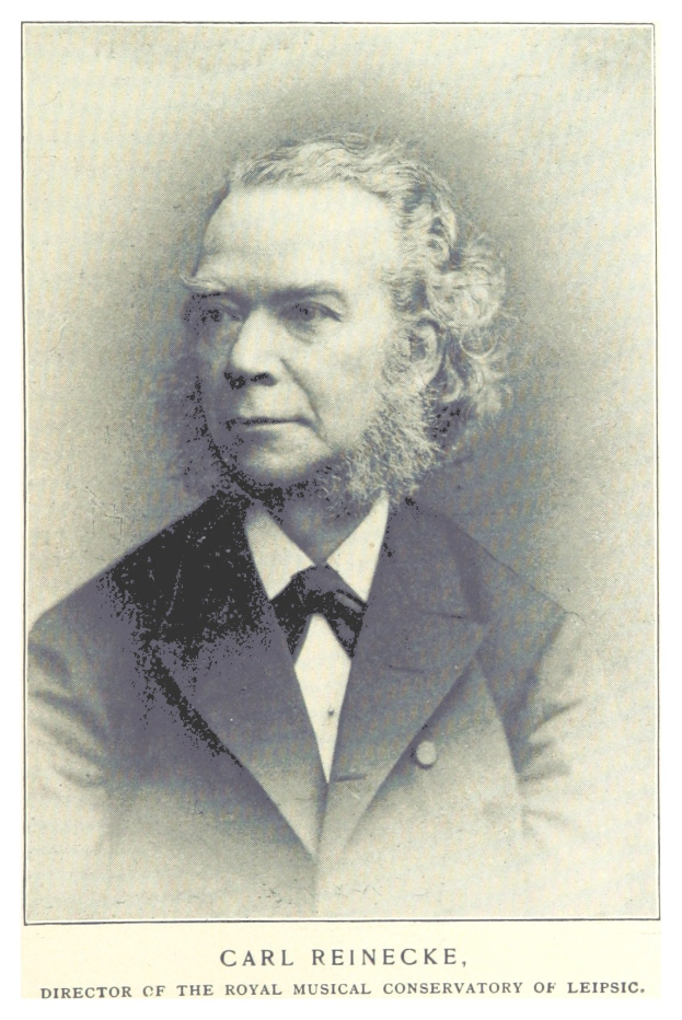 Schwarz-weiß-Porträt von Carl Reinecke, Direktor des Königlichen Musikalischen Konservatoriums Leipzig, in einem Anzug mit Text unten.